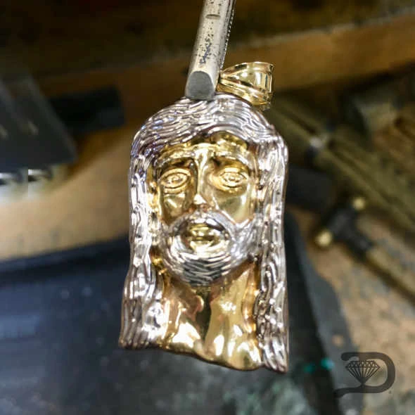 Heirloom lion pendant — restoration and polish — after