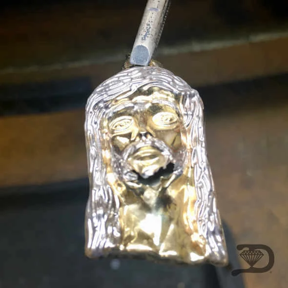Heirloom lion pendant — restoration and polish — before